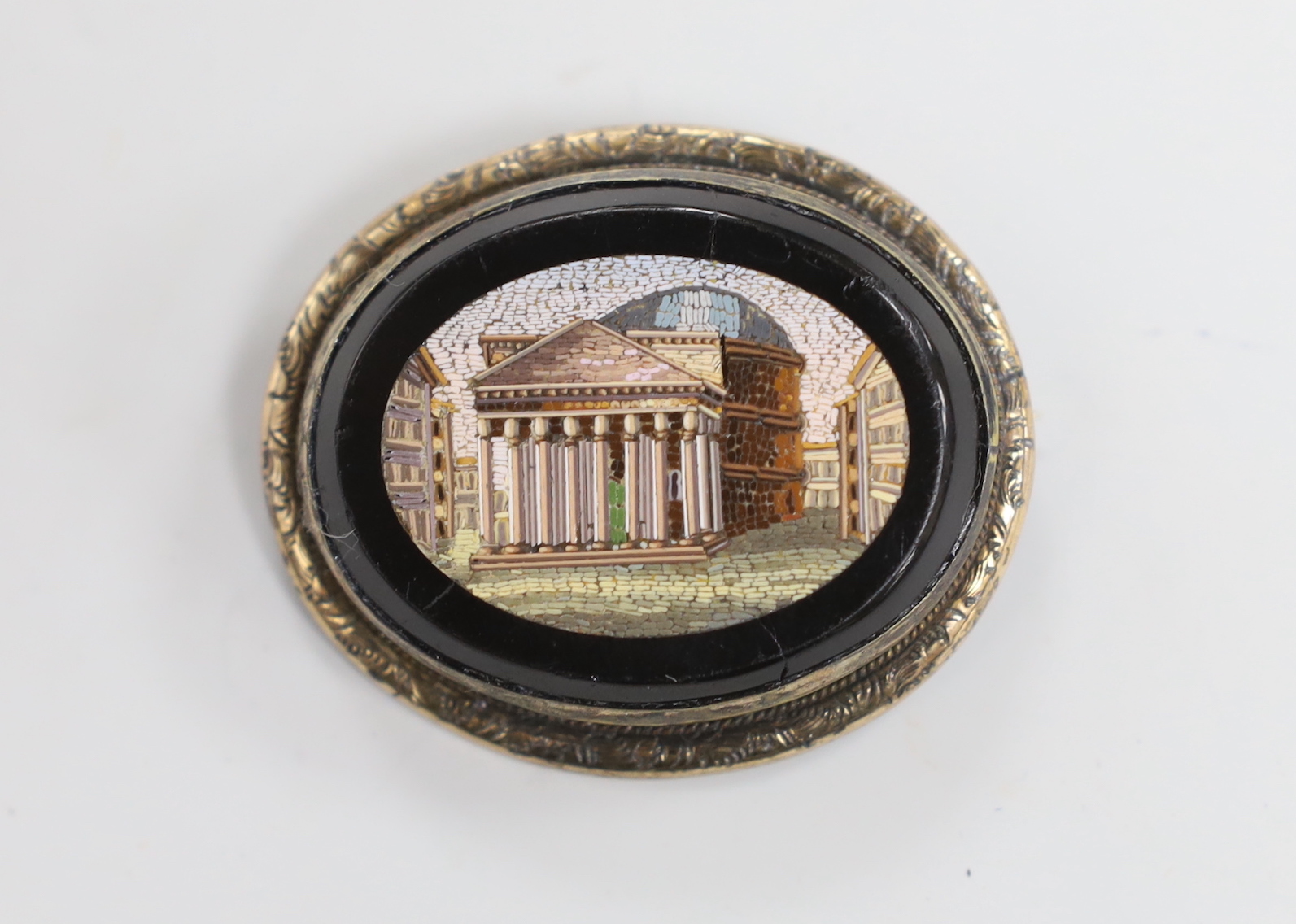 A Victorian gilt metal mounted micro mosaic oval brooch, depicting the Pantheon in Rome, 44mm.